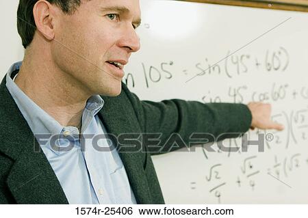 Male teacher pointing to a math equation on a whiteboard View Large Photo Image Stock Photograph - Male teacher pointing to a math equation on a whiteboard. Fotosearch