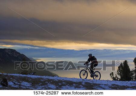 Stock Photo - Man riding a mountain bike. Fotosearch
