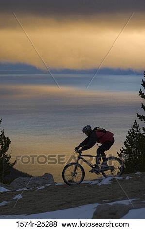 Man riding a mountain bike View Large Photo Image Stock Photo - Man riding a mountain bike. Fotosearch