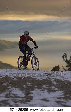 Man riding a mountain bike View Large Photo Image Stock Photography - Man riding a mountain bike. Fotosearch