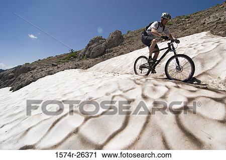 Man riding a mountain bike, Truckee, Californian Sierra Nevada, California, USA View Large Photo Image Stock Image - Man riding a mountain bike, Truckee, Californian Sierra Nevada, California, USA. Fotosearch