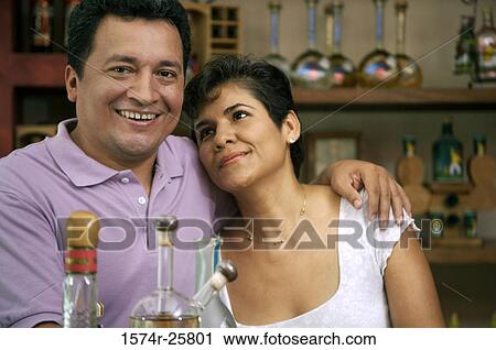 Mature couple smiling in a cafe View Large Photo Image Stock Image - Mature couple smiling in a cafe. Fotosearch