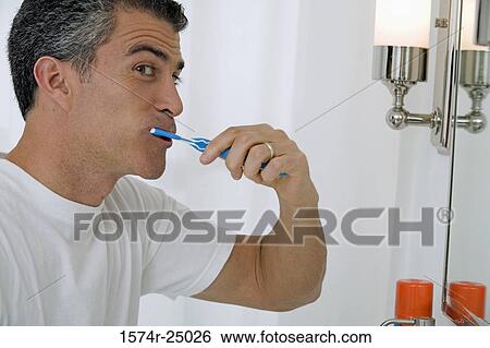Mature man brushing his teeth View Large Photo Image Stock Photograph - Mature man brushing his teeth. Fotosearch