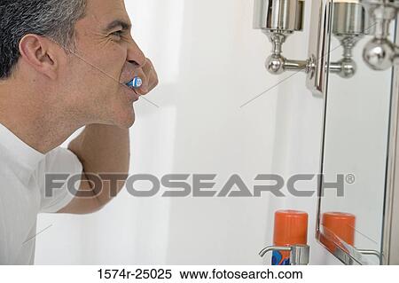 Mature man brushing his teeth View Large Photo Image Stock Photography - Mature man brushing his teeth. Fotosearch
