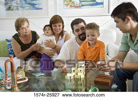 Stock Photo - Mature man playing with his son with blocks. Fotosearch