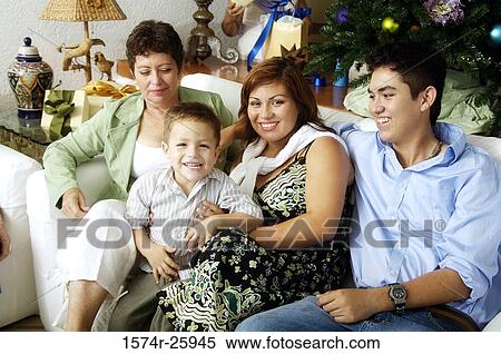 Mature woman with her family sitting on a couch View Large Photo Image Stock Photography - Mature woman with her family sitting on a couch. Fotosearch