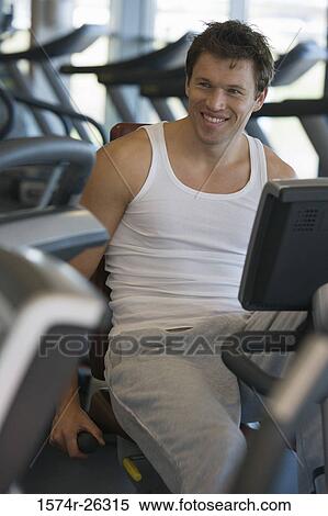 Mid adult man exercising View Large Photo Image Stock Photography - Mid adult man exercising. Fotosearch