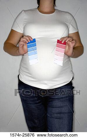 Mid section view of a young woman showing color swatches View Large Photo Image Stock Photograph - Mid section view of a young woman showing color swatches. Fotosearch