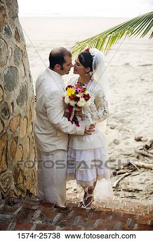 Stock Photo - Newlywed couple nuzzling. Fotosearch