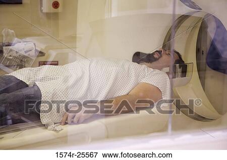 Patient getting an MRI scan View Large Photo Image Stock Photo - Patient getting an MRI scan. Fotosearch