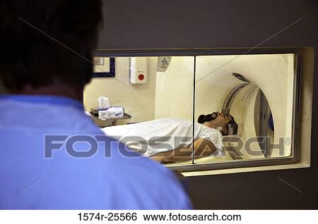 Patient getting an MRI scan View Large Photo Image Stock Photograph - Patient getting an MRI scan. Fotosearch