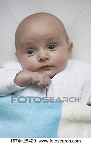 Portrait of a baby looking surprised View Large Photo Image Stock Photo - Portrait of a baby looking surprised. Fotosearch
