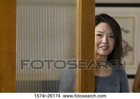 Portrait of a businesswoman beside a door View Large Photo Image Picture - Portrait of a businesswoman beside a door. Fotosearch