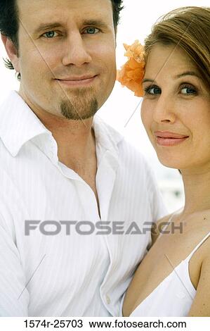 Portrait of a mid adult man and a young woman smirking View Large Photo Image Stock Image - Portrait of a mid adult man and a young woman smirking. Fotosearch