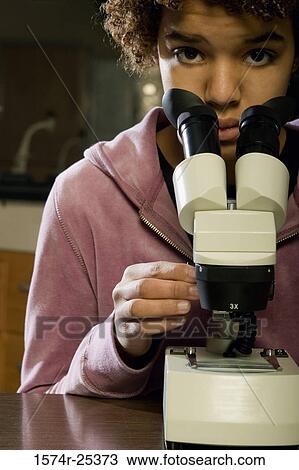 Portrait of a student with a microscope View Large Photo Image Stock Image - Portrait of a student with a microscope. Fotosearch