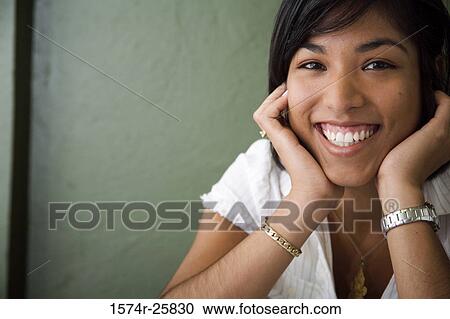 Stock Image - Portrait of a young woman smiling. Fotosearch