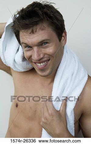 Portrait of mid adult man with a towel around his neck View Large Photo Image Stock Photograph - Portrait of mid adult man with a towel around his neck. Fotosearch