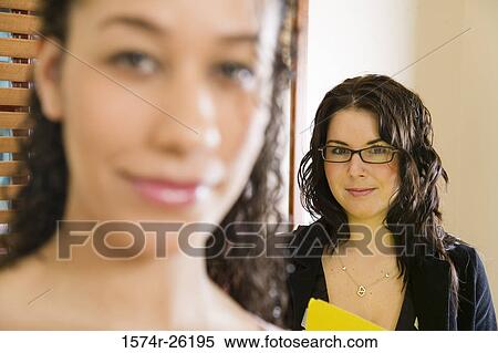 Stock Photography - Portrait of two businesswomen. Fotosearch