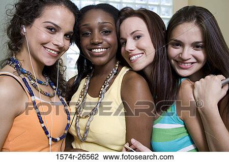 Portrait of two teenage girls and two young women smiling View Large Photo Image Stock Image - Portrait of two teenage girls and two young women smiling. Fotosearch