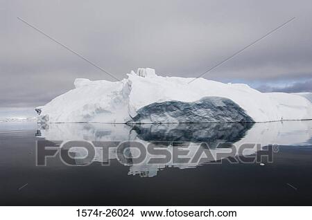 Reflection of an iceberg in water View Large Photo Image Picture - Reflection of an iceberg in water. Fotosearch