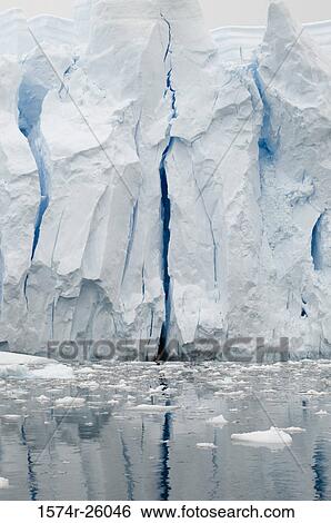 Reflection of an iceberg in water View Large Photo Image Stock Photograph - Reflection of an iceberg in water. Fotosearch