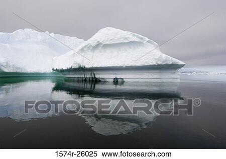 Reflection of icebergs in water View Large Photo Image Stock Photography - Reflection of icebergs in water. Fotosearch