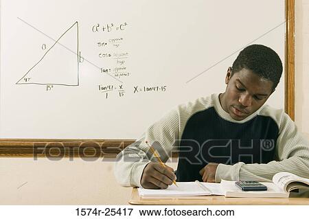 Student writing in a notebook View Large Photo Image Stock Photo - Student writing in a notebook. Fotosearch