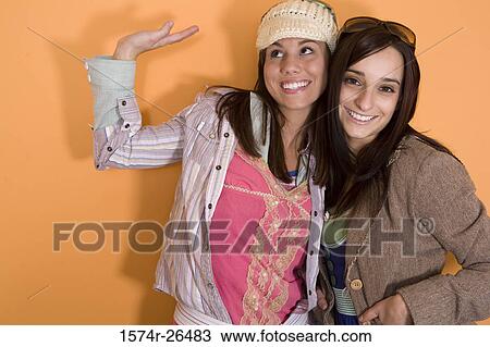 Teenage girl and a young woman smiling View Large Photo Image Stock Image - Teenage girl and a young woman smiling. Fotosearch