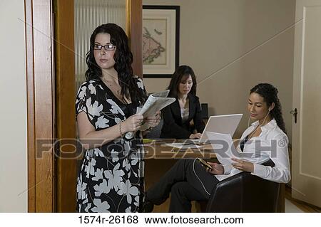 Stock Photo - Three businesswomen in an office. Fotosearch