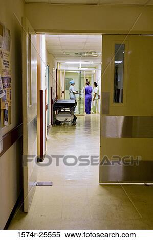 Three female nurses standing in a corridor of hospital View Large Photo Image Stock Photography - Three female nurses standing in a corridor of hospital. Fotosearch