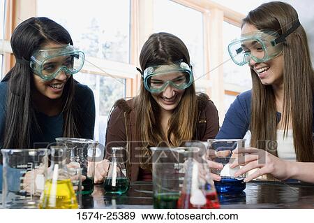 Three students with beakers laughing in a science lab View Large Photo Image Stock Photo - Three students with beakers laughing in a science lab. Fotosearch