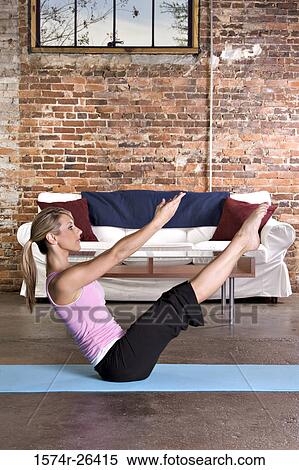 Young woman exercising on an exercise mat View Large Photo Image Stock Photography - Young woman exercising on an exercise mat. Fotosearch