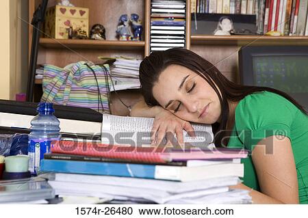 Young woman sleeping on textbooks View Large Photo Image Stock Image - Young woman sleeping on textbooks. Fotosearch