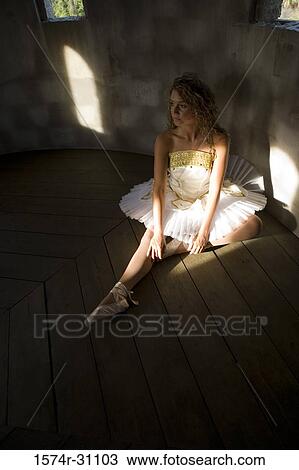 Ballet dancer exercising on hardwood floor View Large Photo Image Stock Image - Ballet dancer exercising on hardwood floor. Fotosearch