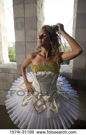 Stock Photo - Ballet dancer wearing tutu with hand in hair. Fotosearch