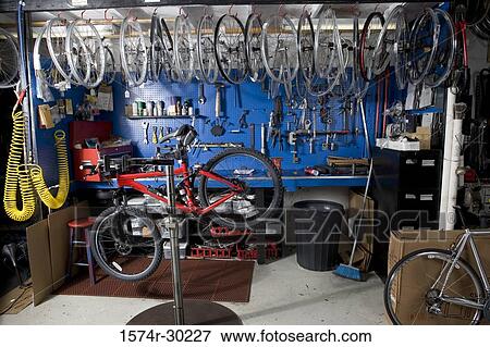 Bicycle in a workshop View Large Photo Image Stock Photo - Bicycle in a workshop. Fotosearch
