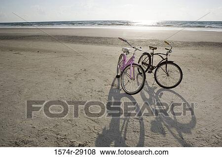 Bicycles on the beach View Large Photo Image Stock Photo - Bicycles on the beach. Fotosearch