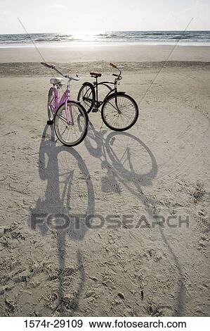 Bicycles on the beach View Large Photo Image Stock Photo - Bicycles on the beach. Fotosearch