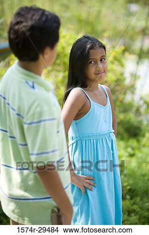 Boy and girl standing together View Large Photo Image Picture - Boy and girl standing together. Fotosearch