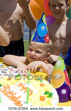 Boys and girls celebrating birthday party View Large Photo Image Picture - Boys and girls celebrating birthday party. Fotosearch