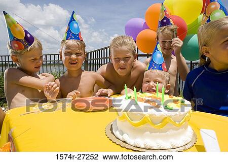 Boys and girls celebrating birthday party View Large Photo Image Stock Image - Boys and girls celebrating birthday party. Fotosearch