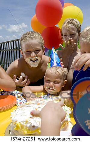 Boys and girls celebrating birthday party View Large Photo Image Stock Image - Boys and girls celebrating birthday party. Fotosearch