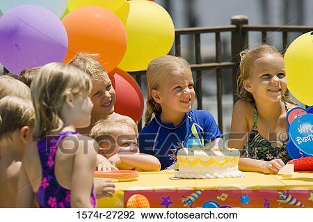 Boys and girls celebrating birthday party View Large Photo Image Stock Image - Boys and girls celebrating birthday party. Fotosearch