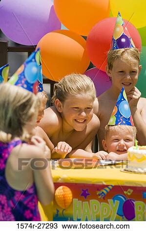 Boys and girls celebrating birthday party View Large Photo Image Stock Image - Boys and girls celebrating birthday party. Fotosearch