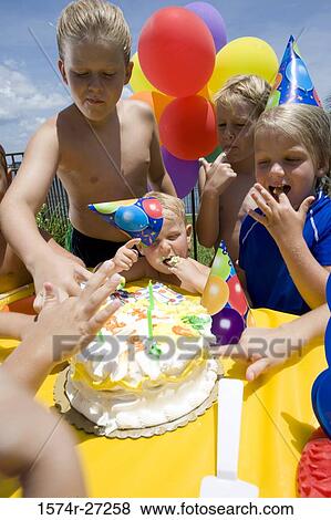 Boys and girls celebrating birthday party View Large Photo Image Stock Photo - Boys and girls celebrating birthday party. Fotosearch