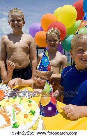 Boys and girls celebrating birthday party View Large Photo Image Stock Photography - Boys and girls celebrating birthday party. Fotosearch