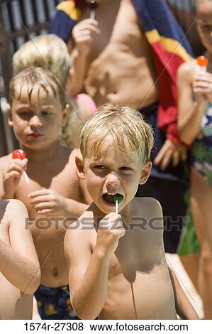 Boys and girls holding lollipops View Large Photo Image Stock Photo - Boys and girls holding lollipops. Fotosearch