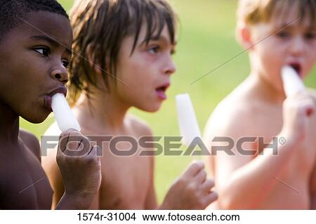Boys eating flavored ice View Large Photo Image Picture - Boys eating flavored ice. Fotosearch