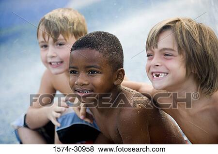 Boys sitting together View Large Photo Image Stock Photo - Boys sitting together. Fotosearch