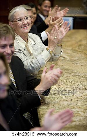 Business people applauding in a meeting at office View Large Photo Image Stock Image - Business people applauding in a meeting at office. Fotosearch